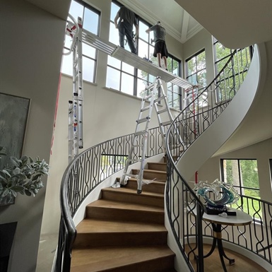 Residential window film protecting interior woodwork and finishes from UV damage in a Shorewood lake home
