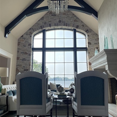 Large lakefront window with LLumar Vista residential window film reducing glare and protecting interior furnishings